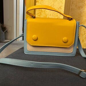 Crossbody Bag no tags  no name brand just a cute bag two tone faux leather front